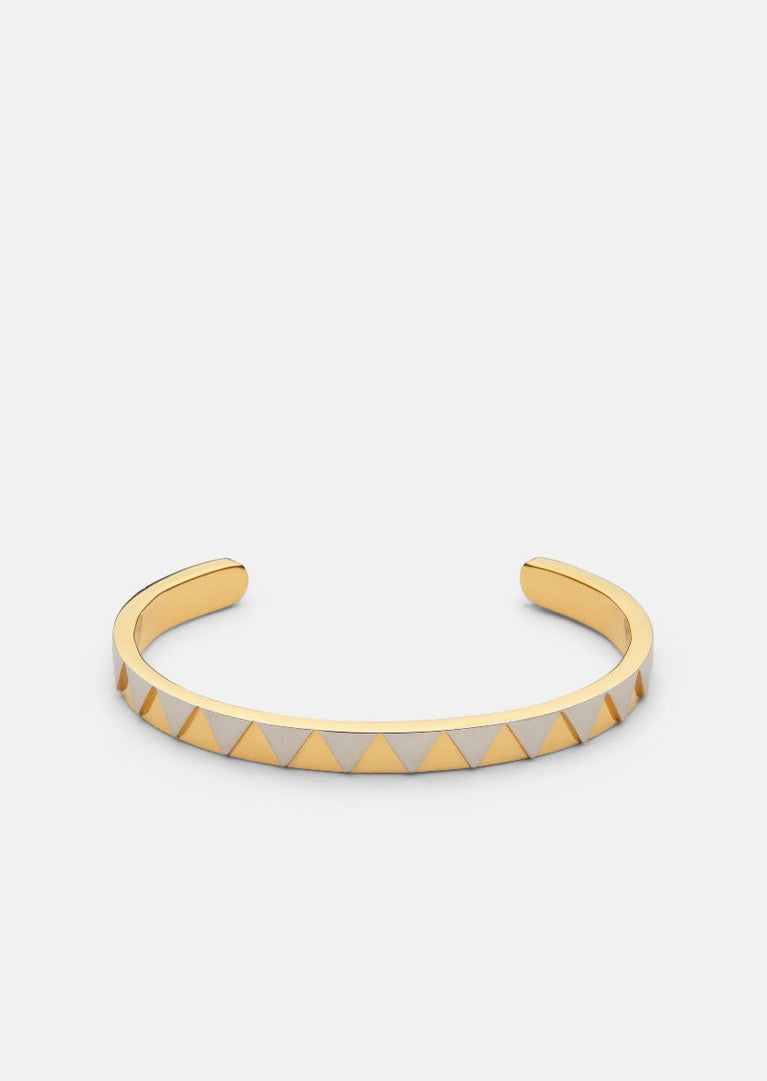 Skultuna GTG Cuff in two-tone metal, stylish accessory with sleek design and polished finish, suitable for everyday wear.