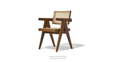 Soho Concept Pierre J Armchair with woven wicker seating and wooden legs, showcasing a stylish and comfortable seating option.