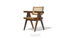 Soho Concept Pierre J Armchair with woven wicker seating and wooden legs, showcasing a stylish and comfortable seating option.