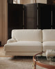 Gubi Flaneur sofa in a modern living room, featuring plush upholstery and sleek design for stylish seating.