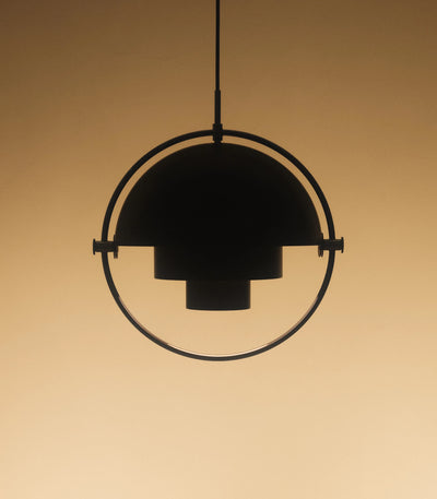 Gubi Multi Lite Pendant lighting fixture with multiple adjustable glass shades hanging from a sleek metal frame.