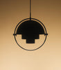 Gubi Multi Lite Pendant lighting fixture with multiple adjustable glass shades hanging from a sleek metal frame.