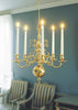 Skultuna chandelier with modern design, featuring multiple light bulbs and sleek metal fixtures for stylish lighting.