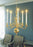 Skultuna chandelier with modern design, featuring multiple light bulbs and sleek metal fixtures for stylish lighting.