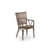 Sika Piano Chair in brown rattan with a wooden seat and curved backrest, designed for comfortable seating and elegant style.