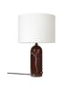 Maroon marble and white Gubi Gravity Table Lamp with a sleek, modern lighting design on a neutral background.