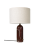 Large maroon marble Gubi Gravity table lamp with a modern, sculptural design and a black base on a neutral background.