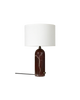Maroon marble and white Gubi Gravity table lamp with a sleek, modern design for stylish lighting.