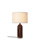Maroon marble Gubi Gravity Table Lamp with a modern, minimalist design and a sleek, curved lighting fixture on a neutral surface