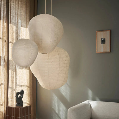 Ferm Living Kurbis lampshade in warm orange with pumpkin design, ideal for cozy lighting in living spaces