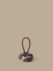 Ferm Living Wa door stopper accessory in sleek, modern design, made of durable material, placed on a wooden floor.