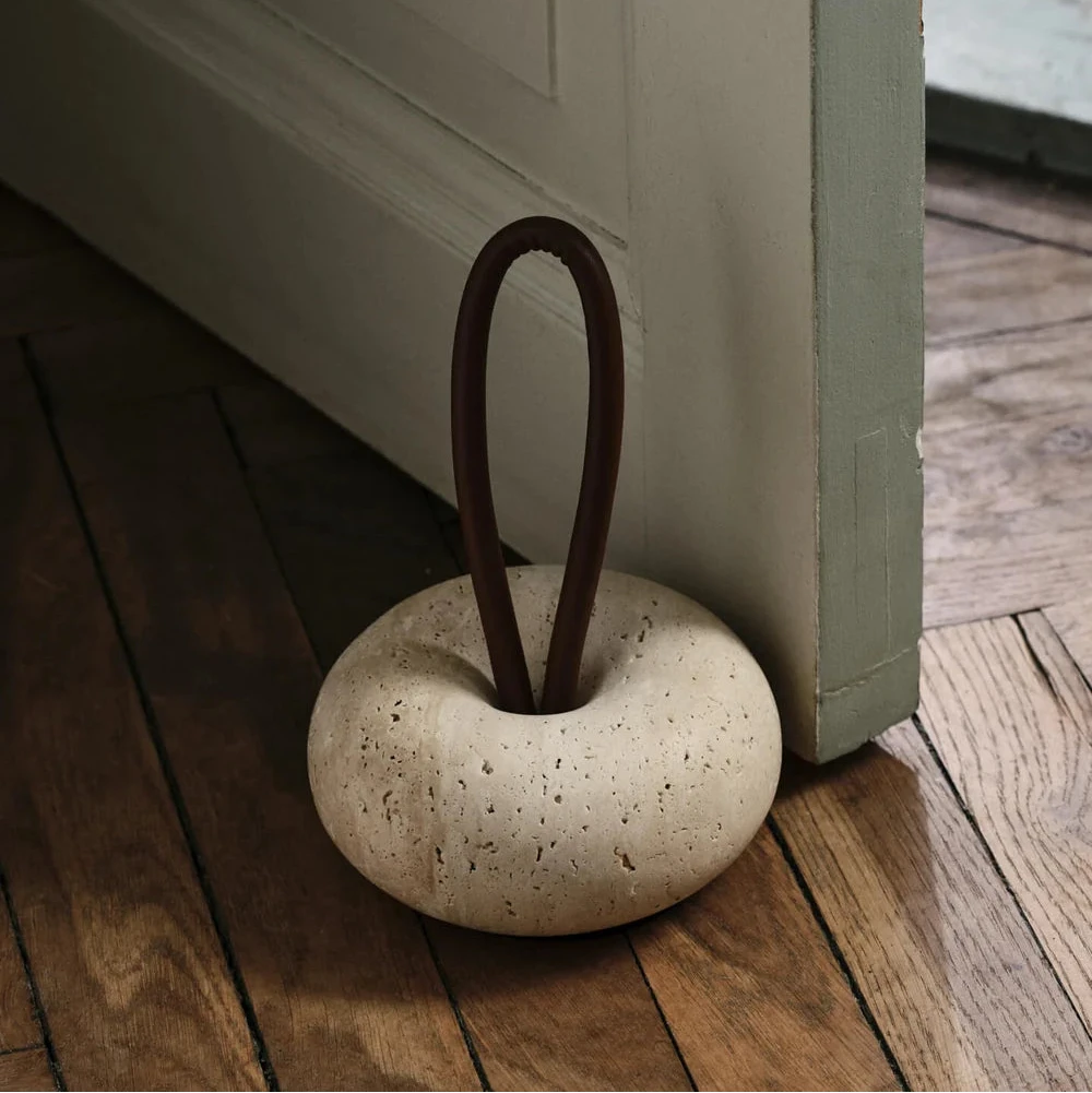 Ferm Living Wa door stopper accessory in neutral color, designed to prevent door movement and protect walls.