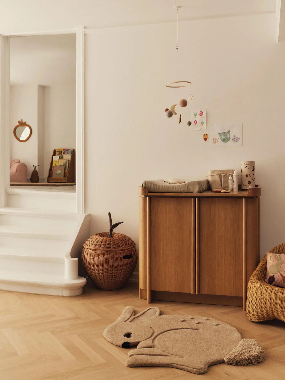 Ferm Living Apple Braided Storage for kids in vibrant colors, featuring a braided design and spacious interior for organizing toys.