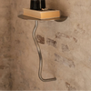 Ferm Living Curvature Wall Table mounted on a wall, featuring a sleek, minimalist design in a modern interior setting