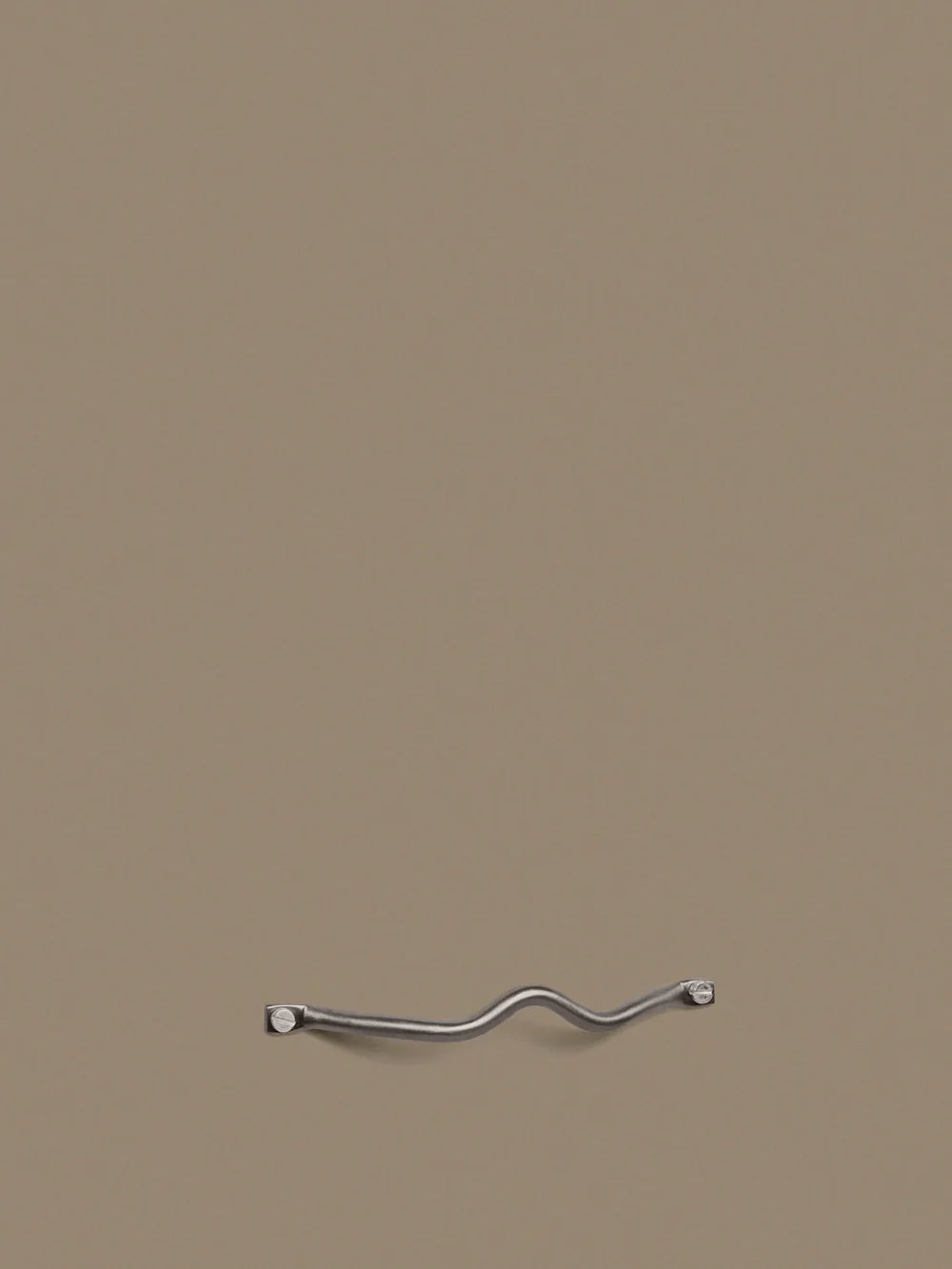 Ferm Living Curvature Handle in accessories, showing a sleek, curved design suitable for furniture or cabinetry.