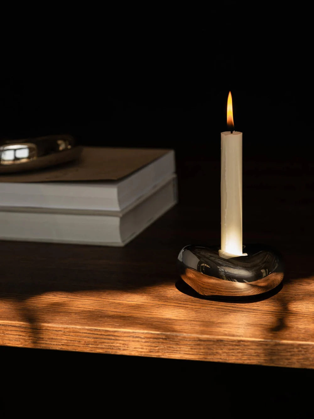 Ferm Living Bellure candle holder accessory with a sleek, modern design featuring a metallic finish and minimalist style.