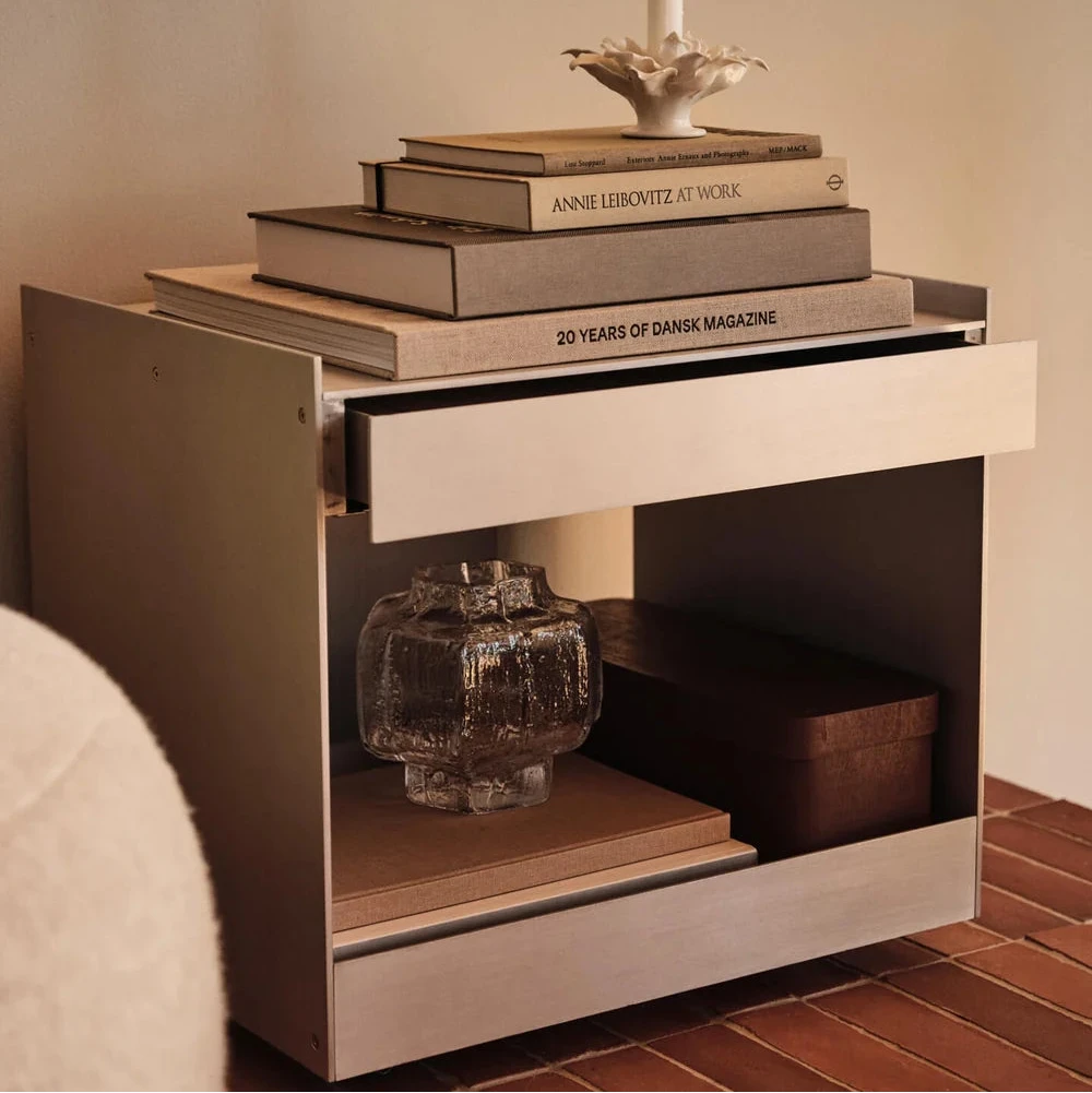 Ferm Living Lager Low Trolley with drawer, modern storage unit on wheels with a sleek wooden finish and black metal frame.