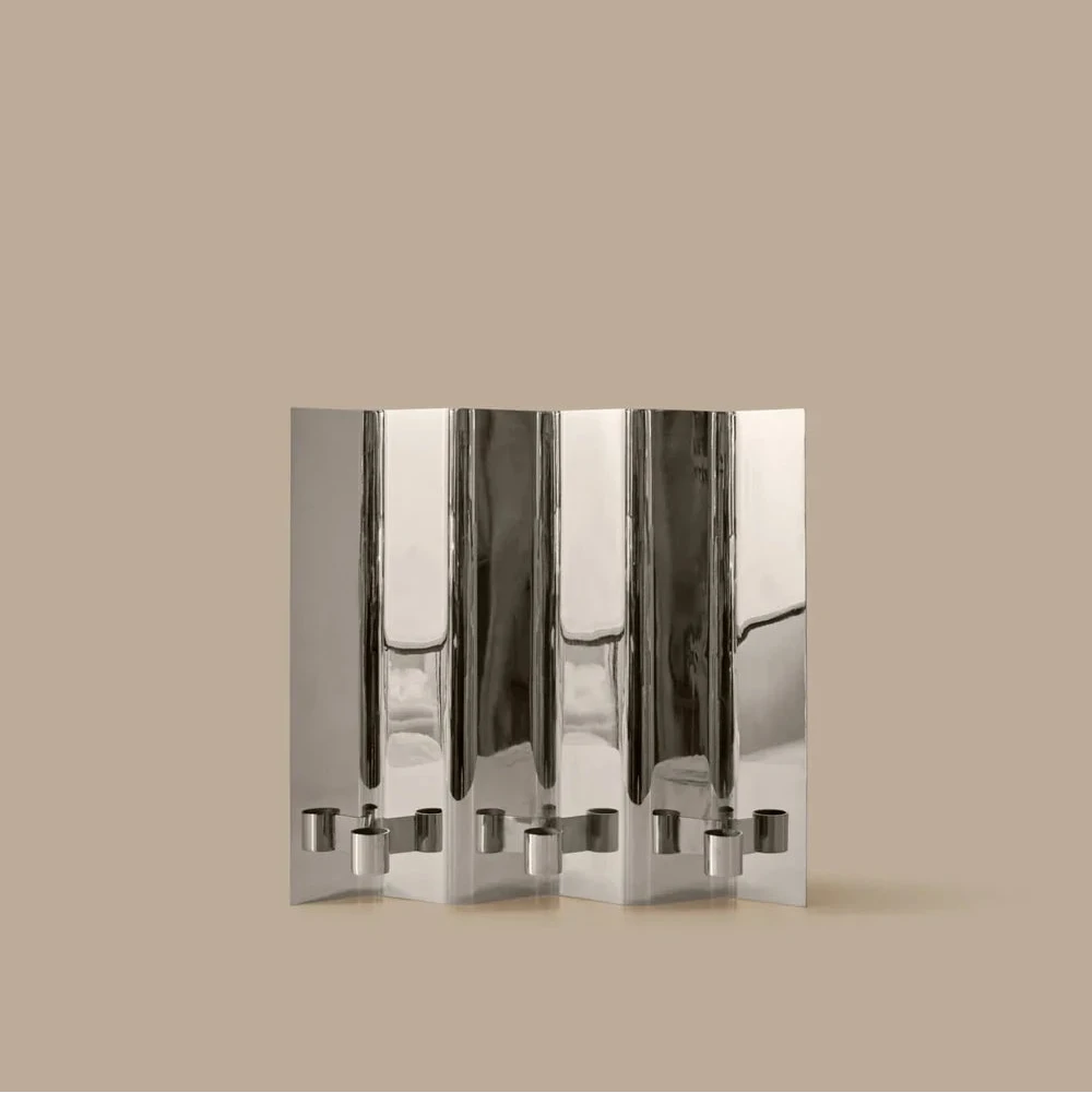 Eddy 3 Wall Candle Holder by Ferm Living, modern wall-mounted accessory with three candle slots, made of black metal.