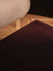 Ferm Living Stille tufted rug with a textured pattern, soft neutral colors, and plush surface for cozy home accessories.