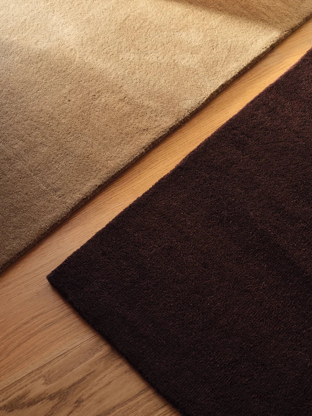 Ferm Living Stille tufted rug with textured design, soft neutral tones, and cozy appearance, perfect as a stylish home accessory.