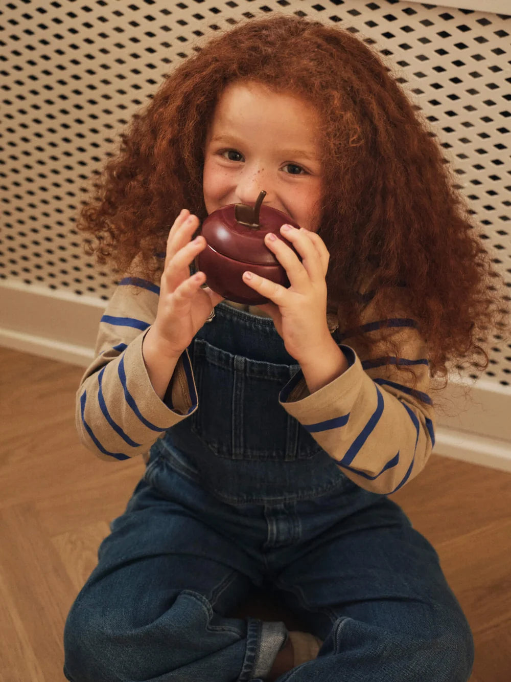 Ferm Living Apple Ceramic Container for kids, featuring a red apple design with a ceramic finish and a playful, child-friendly appearance.