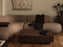 Ferm Living Burl coffee table with rounded wooden surface and sleek legs, modern Scandinavian design for living room decor.