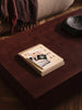 Ferm Living Burl Coffee Table with rounded wooden surface and modern design, ideal for living room decor.