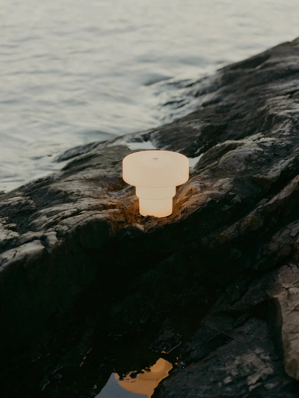 Large Ripple Portable Lamp by Ferm Living, modern lighting with a textured, ripple design on a sleek surface.