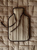 Ferm Living Vari hot water bottle cover in soft fabric with a modern, minimalist design suitable for accessories.