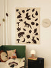 Ferm Living Loopi wall clock for kids, with a colorful circular design and modern style, hanging on a wall.