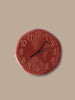 Ferm Living Loopi wall clock for kids, featuring colorful, playful design with round shape and bold numbers on a white background.