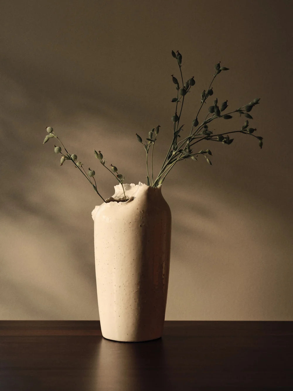Ferm Living Tereo Vase in earthy tones, sleek ceramic accessory with a modern, minimalist design for home decor.