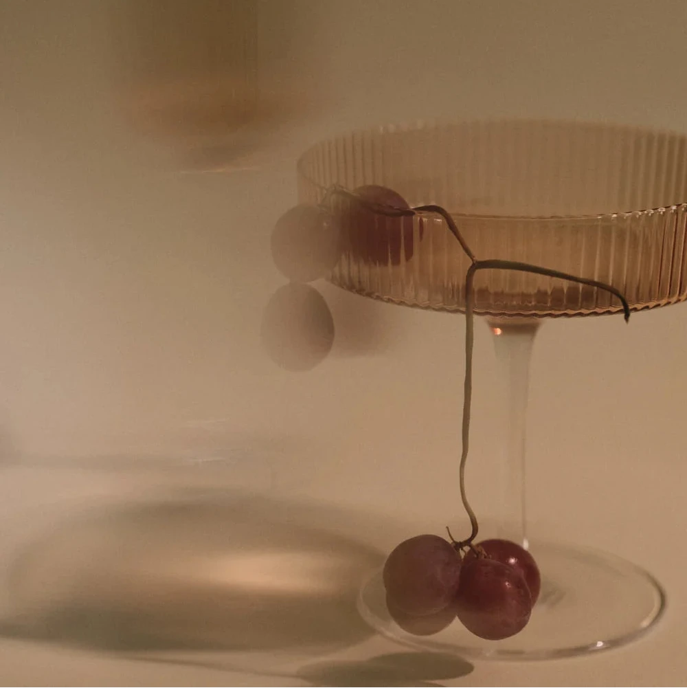 Set of two Ripple Champagne Saucers by Ferm Living, featuring textured glass design perfect for elegant drink service.