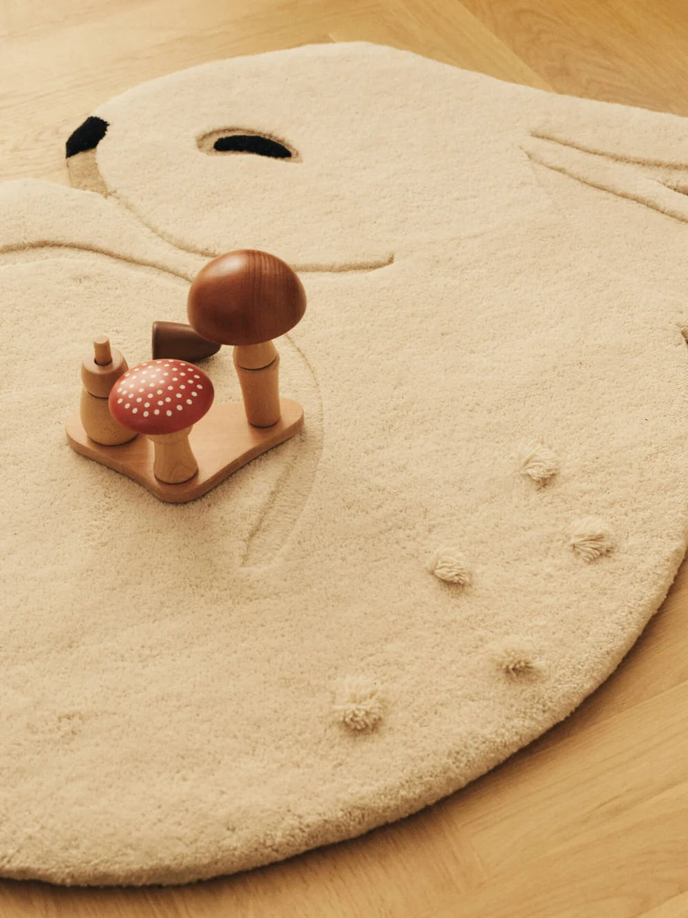 Ferm Living Rabbit Tufted Kids Rug with a cute rabbit design in soft, plush fabric for children's room decor.