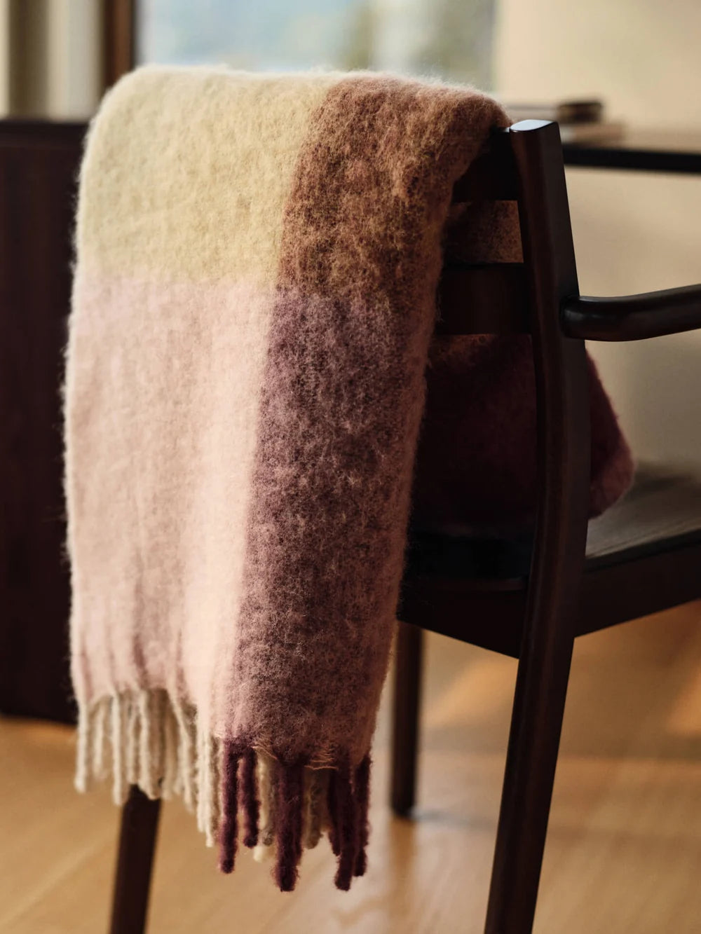 Blur Mohair Blanket by Ferm Living, cozy textured throw with soft mohair fabric, shown in a neutral color on a modern sofa.