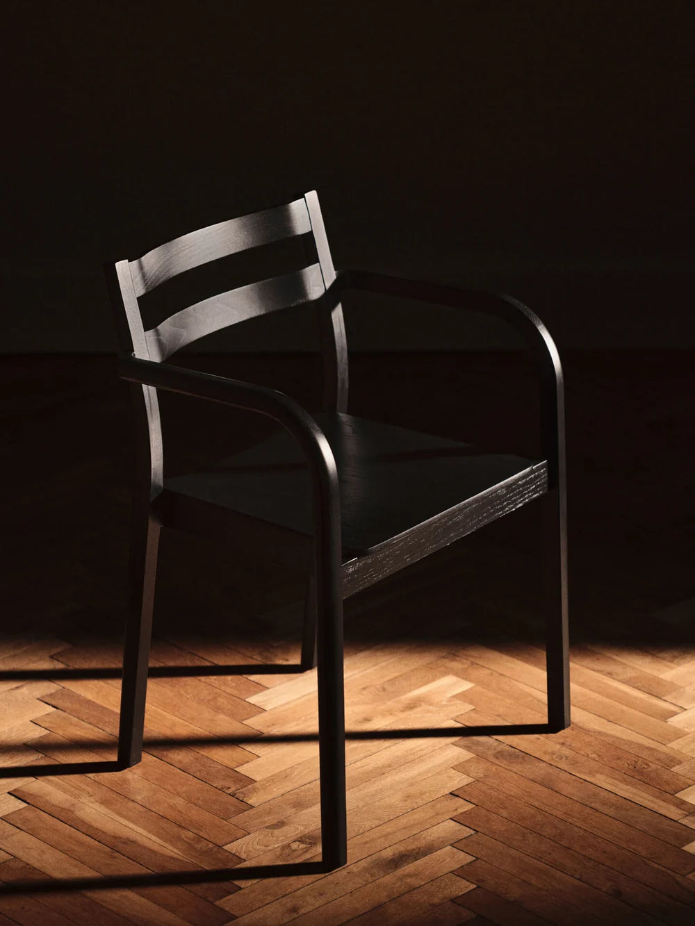 Ferm Living Boda dining chair with armrests, modern seating with wooden legs and upholstered seat, stylish for dining rooms.