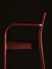 Ferm Living Boda dining chair with arms, featuring a modern design and wooden legs, suitable for kitchen or dining room seating.