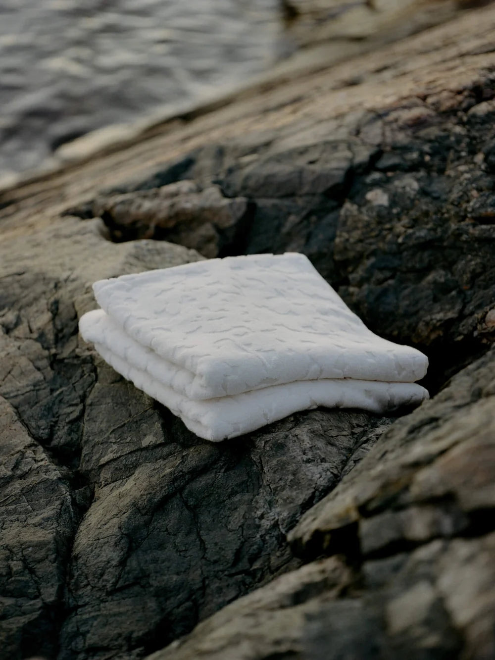 Ferm Living Cilla Towel, soft fabric accessory with colorful striped pattern, displayed folded on a neutral background.