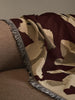 Ferm Living Cilla Tapestry Blanket featuring intricate woven pattern, soft fabric, and decorative fringe edges.