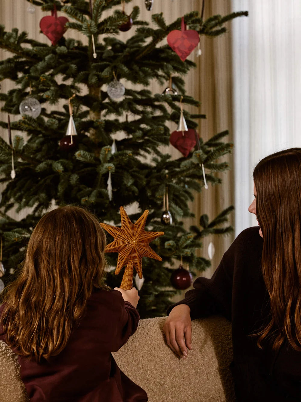 Ferm Living rattan Christmas tree top star accessory, natural woven rattan star decoration for holiday decor.