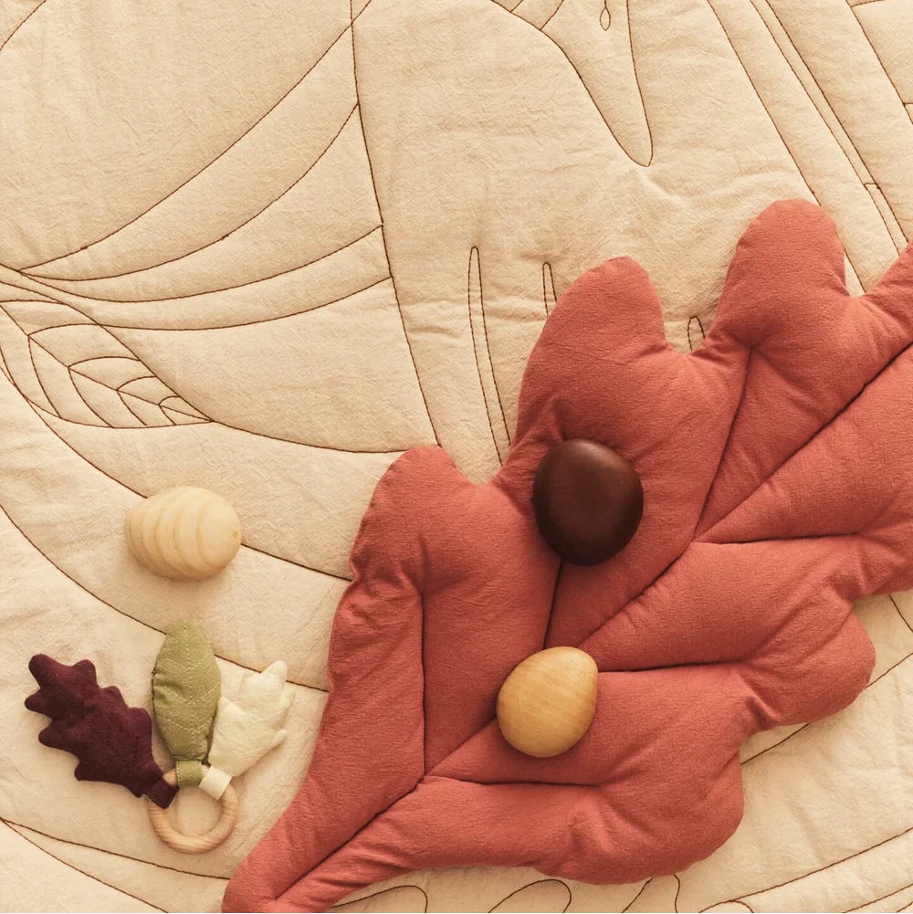Set of 2 kids leaf cushions by Ferm Living featuring soft fabric and playful leaf designs for children's decor.