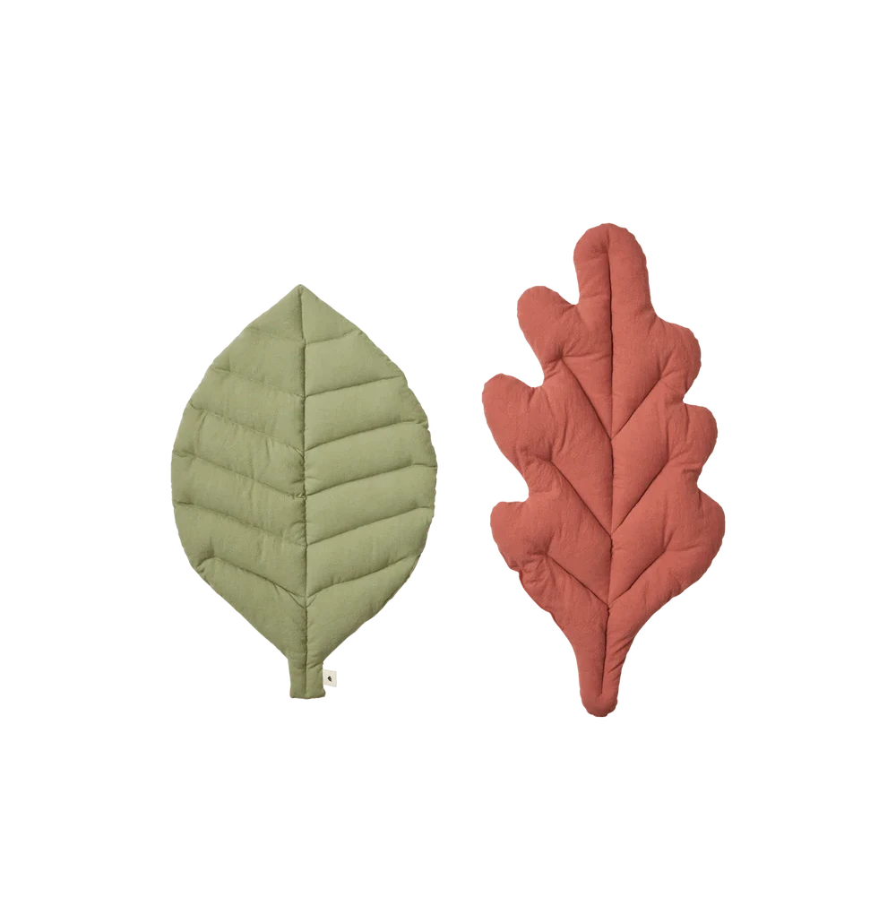 Set of two kids leaf cushions by Ferm Living featuring soft, colorful fabric with leaf-shaped designs for cozy decor.