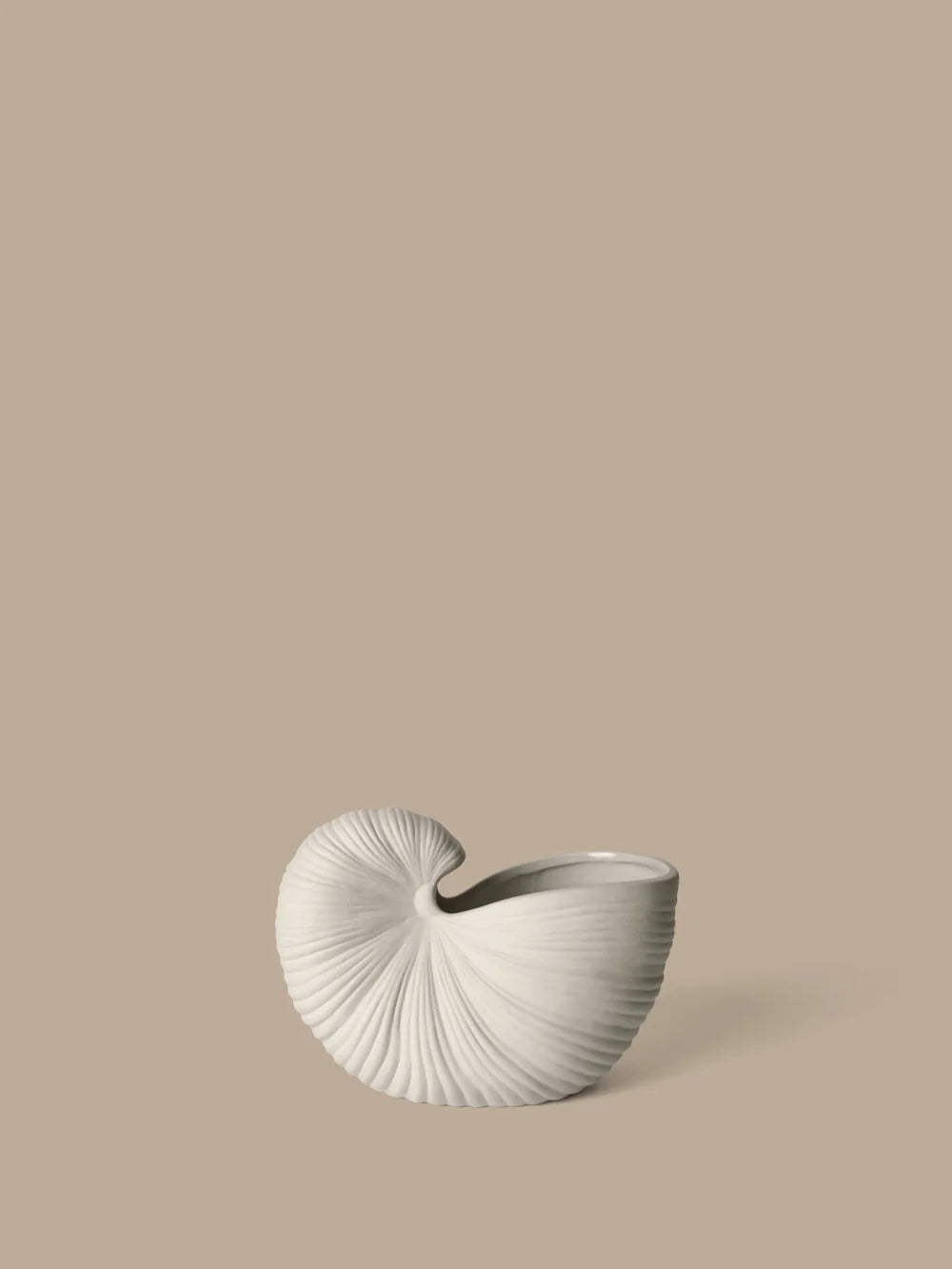 Ferm Living Shell Pot accessory featuring a modern, decorative shell-shaped design in neutral tones.