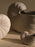 Ferm Living Shell Pot accessory with a modern shell design, made of ceramic, showcasing a smooth, glossy surface.