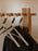 Set of three Ferm Living Bowline clothes hangers, stylish accessories made of wood and metal for organizing clothes.