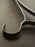 Set of three Ferm Living Bowline clothes hangers, minimalist accessories with sleek wooden design for hanging garments.