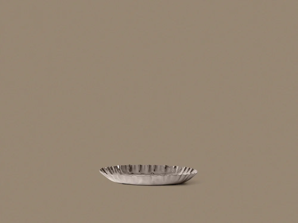 Ferm Living Tydra Tray with woven design and wooden handles, modern home decor accessory, shown in natural light.