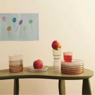 Ripple Kids blow-out cups, plates, and bowls by Ferm Living for children, featuring colorful, modern designs in this product image.