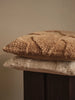 Ferm Living Rime tufted cushion in soft neutral tones, featuring textured fabric and plush filling for cozy home accessories.