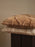 Ferm Living Rime tufted cushion in soft neutral tones, featuring textured fabric and plush filling for cozy home accessories.